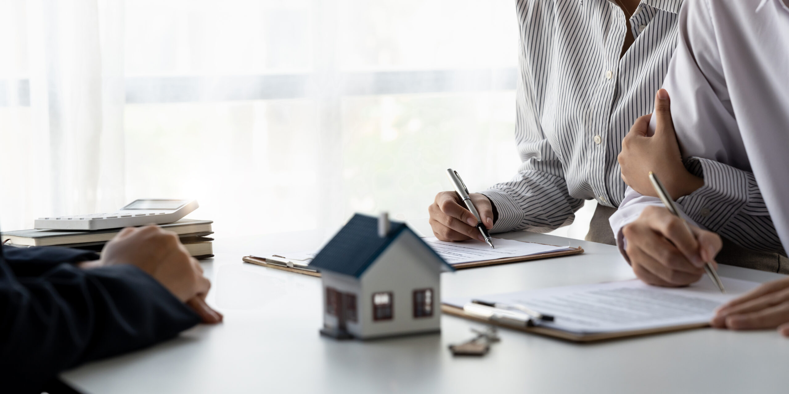 Homeowner signing refinance paperwork in Cooper City, Florida